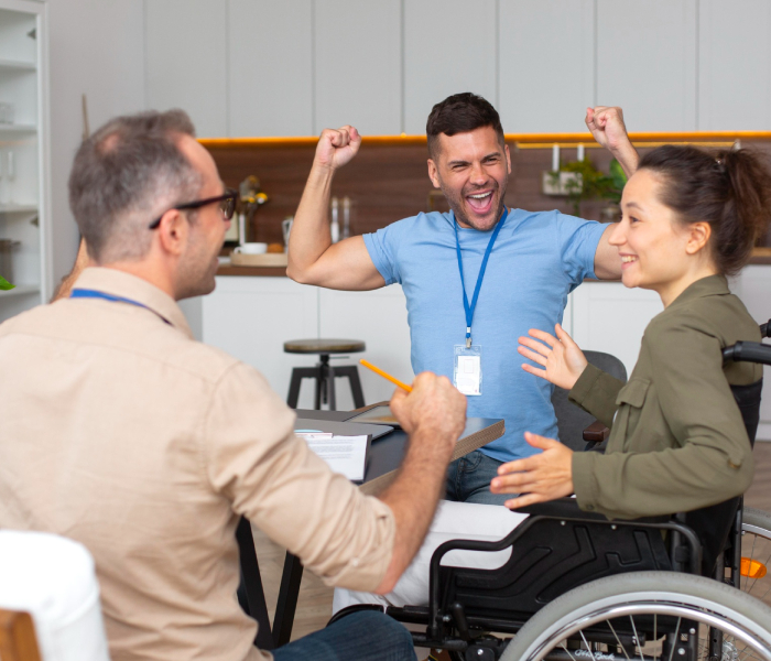 Caring NDIS support worker providing personal care assistance to a participant at home in Melbourne